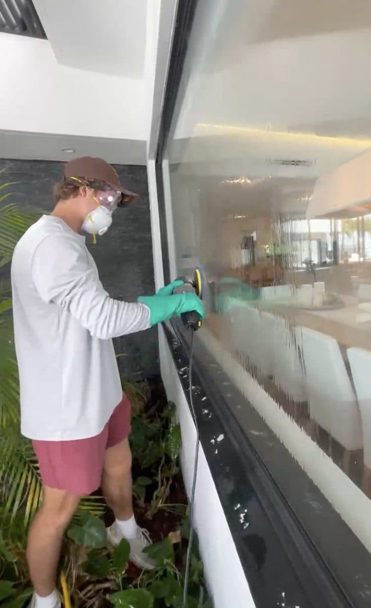 Detail-cleaning glass by hand for a spotless, streak-free finish